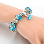 Load image into Gallery viewer, Eloquence of Fifth Chakra Charm Bracelet Worn by Model
