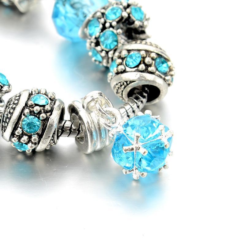 Eloquence of Fifth Chakra Charm Bracelet zoomed on Austrian Blue Crystal Pendant Charm