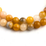 Load image into Gallery viewer, Essence of Life 108 Beads Mala zoomed on natural topaz stones beads seen from top
