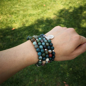 Longevity by Life Tree 108 Beads Mala Wear as bracelet by model in garden environment