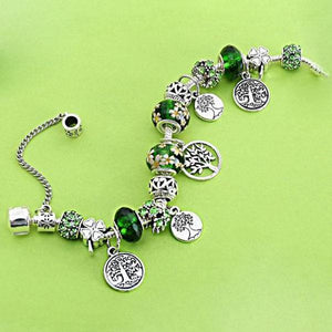 Opened Infinite Wisdom of Tree of Life Charm Bracelet in decorated environment seen from top