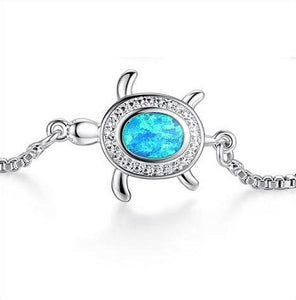 Precious Awareness of the Blind Sea Turtle zoomed on sea turtle incrusted with natural blue opal stone