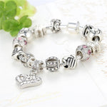 Load image into Gallery viewer, Unconditional True Love Charm Bracelet seen from front in a decorated environment
